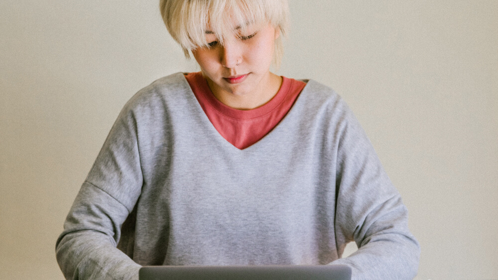 IT security specialist works from laptop.