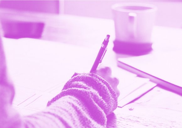 Social worker studying at a table for the BSW exam. Close-up.