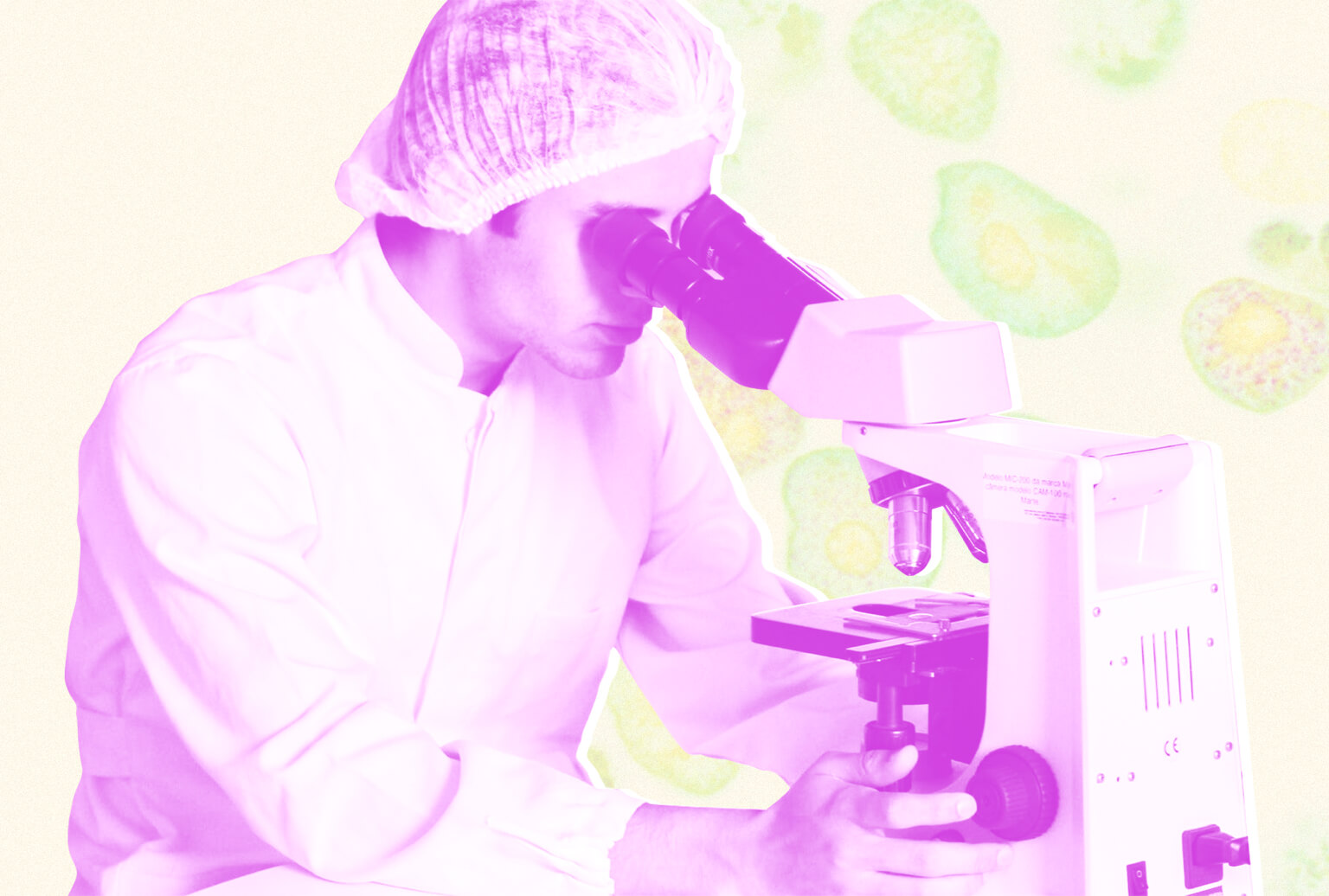 Person wearing hairnet looking through a microscope.