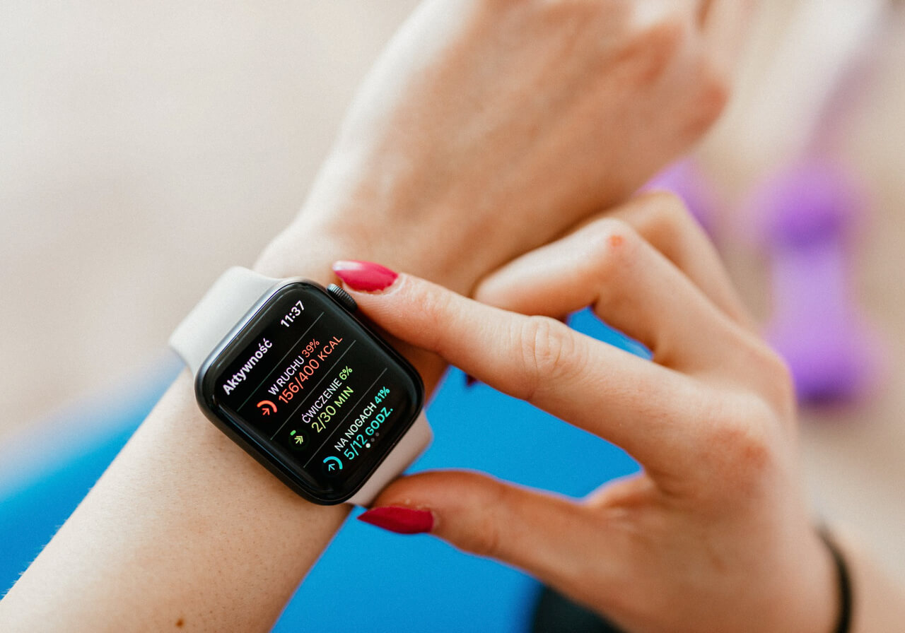 A person checks their statistics on their smartwatch.