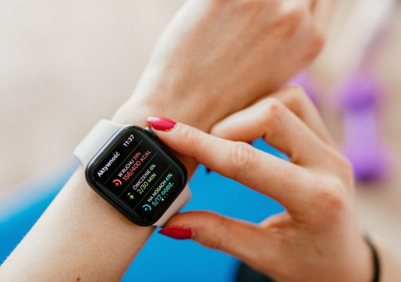 A person checks their statistics on their smartwatch.