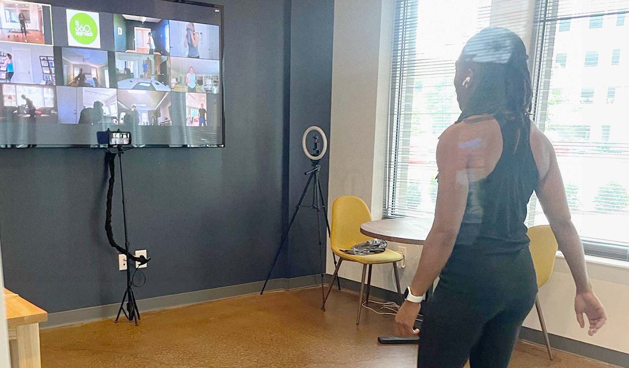 Chan Little - owner of The 360 Approach gym talks to clients via Zoom in her studio.
