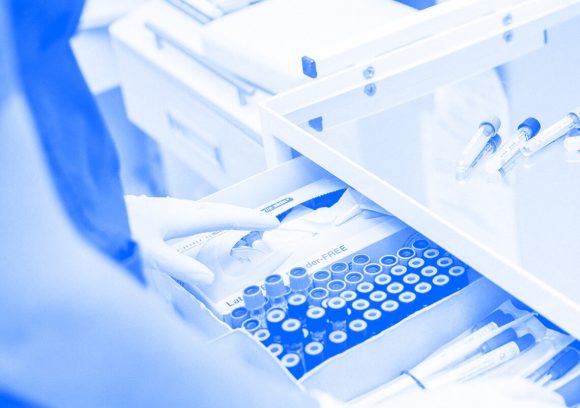 Close up image of a phlebotomist's drawer with sample vials. Tinted blue.